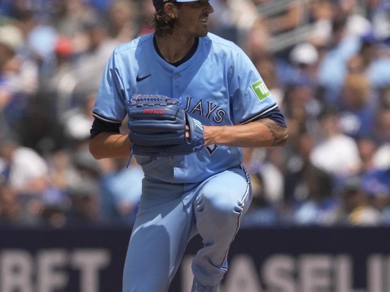 Jul 21, 2024; Toronto, Ontario, CAN; Toronto Blue Jays starting pitcher Kevin Gausman (34) throws against the Detroit Tigers during the third inning at Rogers Centre. Mandatory Credit: John E. Sokolowski-USA TODAY Sports