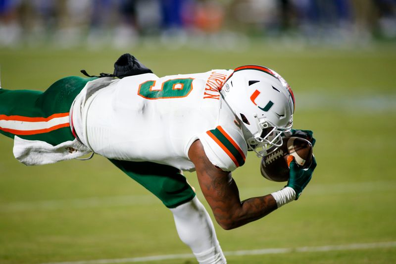 Dec 5, 2020; Durham, North Carolina, USA;  Miami Hurricanes tight end Brevin Jordan (9) dives across the goal line to score against the Duke Blue Devils in the first quarter at Wallace Wade Stadium. Mandatory Credit: Nell Redmond-USA TODAY Sports