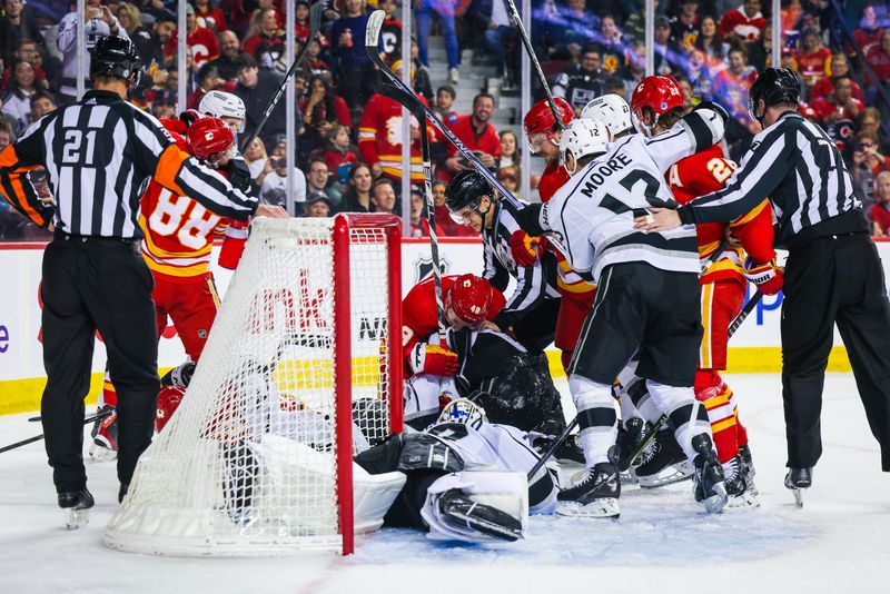 Mar 28, 2023; Calgary, Alberta, CAN; Calgary Flames players and Los Angeles Kings platers get into a scrum during the second period at Scotiabank Saddledome. Mandatory Credit: Sergei Belski-USA TODAY Sports