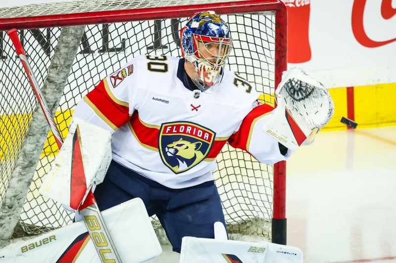 Dec 14, 2024; Calgary, Alberta, CAN; Florida Panthers goaltender Spencer Knight (30) guards his net during the warmup period against the Calgary Flames at Scotiabank Saddledome. Mandatory Credit: Sergei Belski-Imagn Images