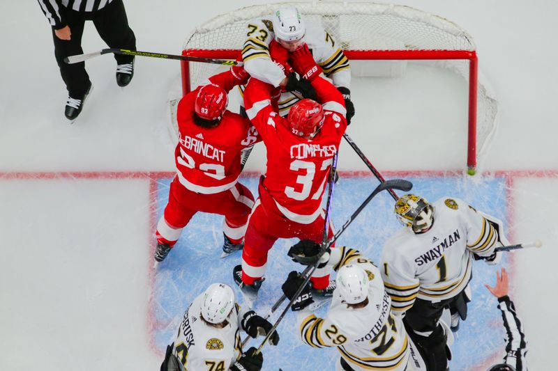 Dec 31, 2023; Detroit, Michigan, USA; Detroit Red Wings left wing J.T. Compher (37) and right wing Alex DeBrincat (93) scuffle with Boston Bruins defenseman Charlie McAvoy (73) in front of the net during the game between the Boston Bruins and the Detroit Red Wings at Little Caesars Arena. Mandatory Credit: Brian Bradshaw Sevald-USA TODAY Sports