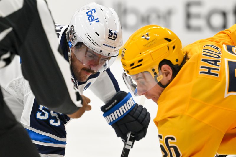 Nov 29, 2025; Nashville, Tennessee, USA; Winnipeg Jets center Mark Scheifele (55) and Nashville Predators left wing Erik Haula (56) wait for a faceoff during the second period at Bridgestone Arena. Mandatory Credit: Steve Roberts-Imagn Images