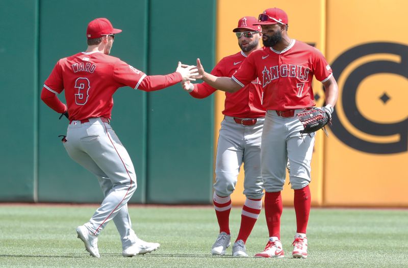 May 8, 2024; Pittsburgh, Pennsylvania, USA;  Los Angeles Angels left fielder Taylor Ward (3) and center fielder Kevin Pillar (12) and right fielder Jo Adell (7)  celebrate in the outfield after defeating the Pittsburgh Pirates at PNC Park. Mandatory Credit: Charles LeClaire-USA TODAY Sports