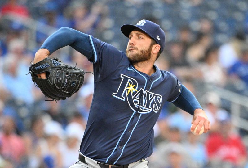 Jul 25, 2024; Toronto, Ontario, CAN;   Tampa Bay Rays relief pitcher Colin Poche (38) delivers against the Toronto Blue Jays in the ninth inning at Rogers Centre. Mandatory Credit: Dan Hamilton-USA TODAY Sports