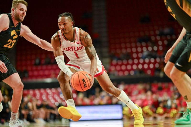 Feb 14, 2024; College Park, Maryland, USA;  Maryland Terrapins guard Jahmir Young (1) makes a m move to there basket on Iowa Hawkeyes forward Ben Krikke (23) during the second half at Xfinity Center. Mandatory Credit: Tommy Gilligan-USA TODAY Sports