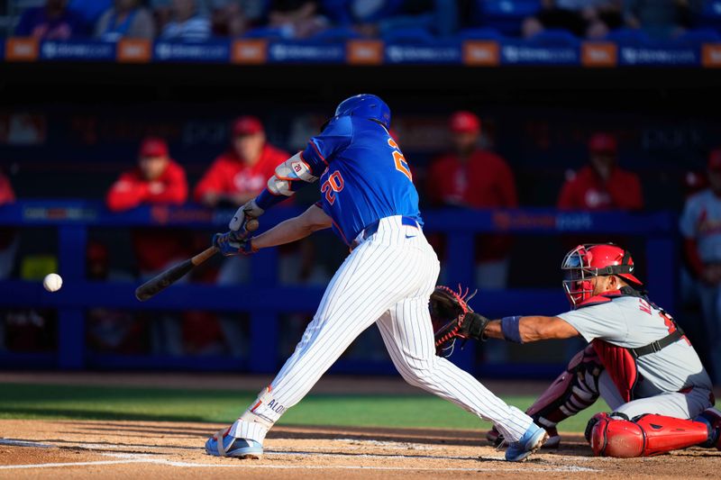 Mar 19, 2024; Port St. Lucie, Florida, USA; New York Mets first baseman Pete Alonso (20) hits a single against the St. Louis Cardinals during the first inning at Clover Park. Mandatory Credit: Rich Storry-USA TODAY Sports