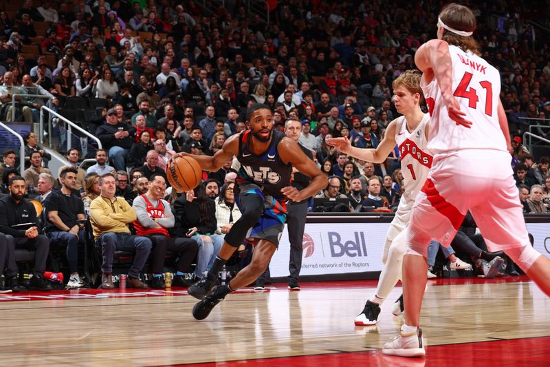 TORONTO, CANADA - MARCH 25: Mikal Bridges #1 of the Brooklyn Nets handles the ball during the game against the Toronto Raptors on March 25, 2024 at the Scotiabank Arena in Toronto, Ontario, Canada.  NOTE TO USER: User expressly acknowledges and agrees that, by downloading and or using this Photograph, user is consenting to the terms and conditions of the Getty Images License Agreement.  Mandatory Copyright Notice: Copyright 2024 NBAE (Photo by Vaughn Ridley/NBAE via Getty Images)