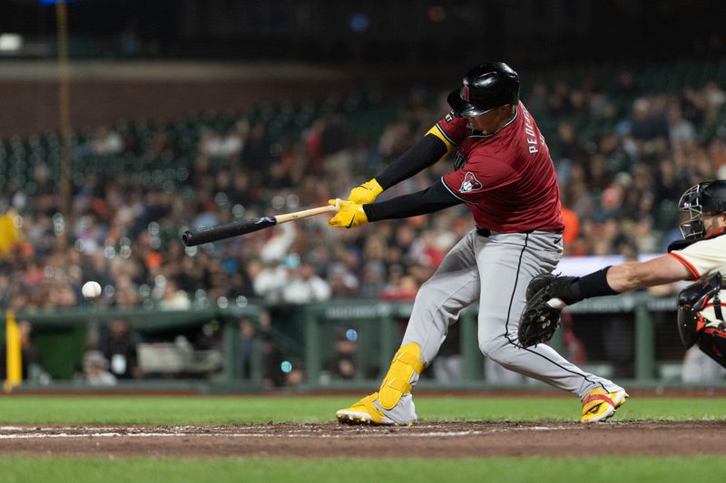 Sep 4, 2024; San Francisco, California, USA;  Arizona Diamondbacks designated hitter Joc Pederson (3) hits a single during the seventh inning against the San Francisco Giants at Oracle Park. Mandatory Credit: Stan Szeto-Imagn Images