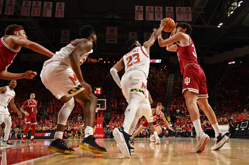 Jan 31, 2023; College Park, Maryland, USA;  \h233\ blocks Indiana Hoosiers guard Trey Galloway (32) pass during the first half at Xfinity Center. Mandatory Credit: Tommy Gilligan-USA TODAY Sports