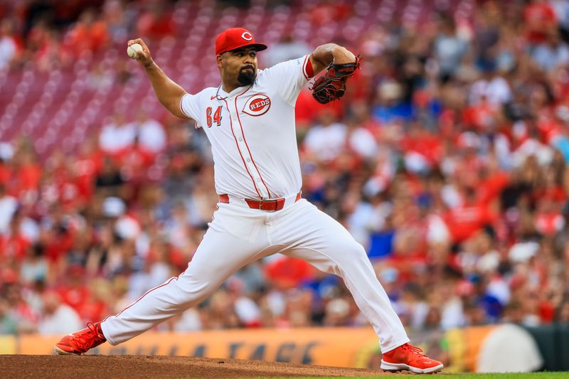 Jul 30, 2024; Cincinnati, Ohio, USA; Cincinnati Reds starting pitcher Tony Santillan (64) pitches against the Chicago Cubs in the first inning at Great American Ball Park. Mandatory Credit: Katie Stratman-USA TODAY Sports