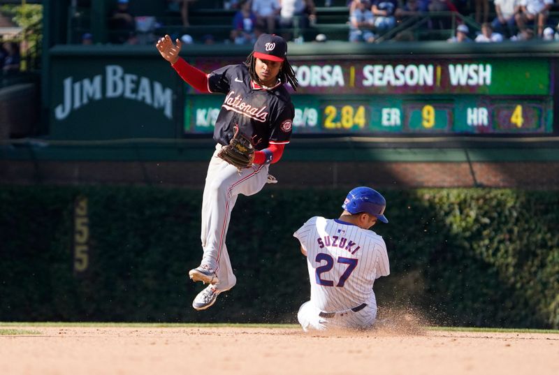 Sep 20, 2024; Chicago, Illinois, USA; Chicago Cubs outfielder Seiya Suzuki (27) steals second base as Washington Nationals shortstop CJ Abrams (5) takes the throw during the eighth inning at Wrigley Field. Mandatory Credit: David Banks-Imagn Images