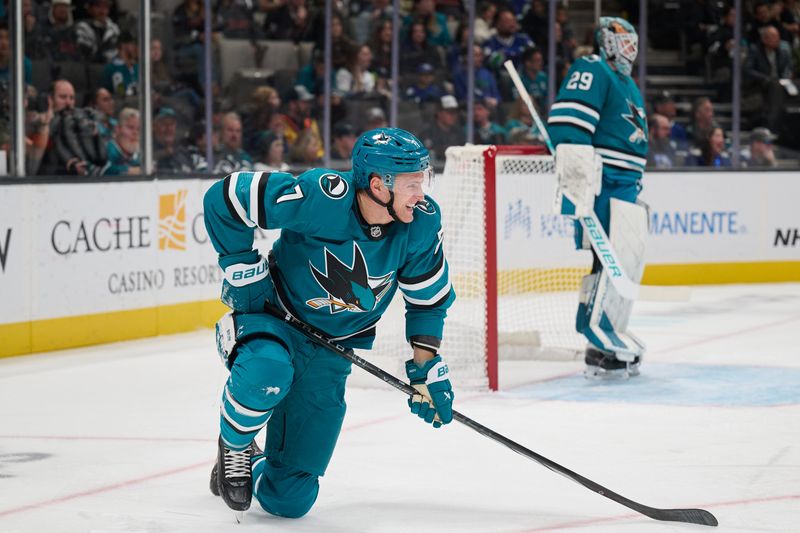 Nov 2, 2024; San Jose, California, USA; San Jose Sharks center Nico Sturm (7) reacts after a check against the Vancouver Canucks during the first period at SAP Center at San Jose. Mandatory Credit: Robert Edwards-Imagn Images