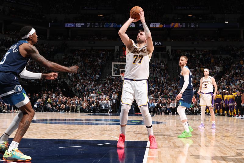 MINNEAPOLIS, MN -  APRIL  27:  Luka Doncic #77 of the Los Angeles Lakers shoots the ball during the game against the Minnesota Timberwolves during Round 1 Game 4 of the 2025 NBA Playoffs  on April 27, 2025 at Target Center in Minneapolis, Minnesota. NOTE TO USER: User expressly acknowledges and agrees that, by downloading and or using this Photograph, user is consenting to the terms and conditions of the Getty Images License Agreement. Mandatory Copyright Notice: Copyright 2025 NBAE (Photo by David Sherman/NBAE via Getty Images)