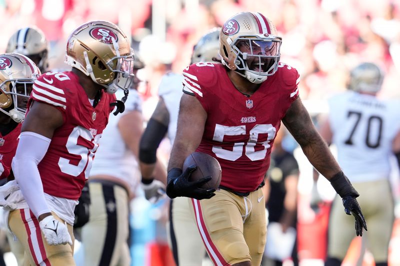 San Francisco 49ers defensive lineman Alex Barrett (58) celebrates with teammates after recovering a fumble by New Orleans Saints quarterback Spencer Rattler during the first half of a preseason NFL football game in Santa Clara, Calif., Sunday, Aug. 18, 2024. (AP Photo/Godofredo A. Vásquez)