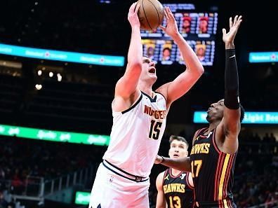 ATLANTA, GA - DECEMBER 11: Nikola Jokic #15 of the Denver Nuggets drives to the basket during the game against the Atlanta Hawks on December 11, 2023 at State Farm Arena in Atlanta, Georgia.  NOTE TO USER: User expressly acknowledges and agrees that, by downloading and/or using this Photograph, user is consenting to the terms and conditions of the Getty Images License Agreement. Mandatory Copyright Notice: Copyright 2023 NBAE (Photo by Adam Hagy/NBAE via Getty Images)