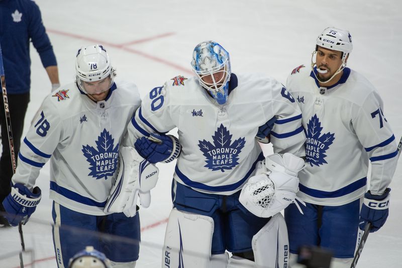 Dec 7, 2023; Ottawa, Ontario, CAN; Toronto Maple Leafs goalie Joseph Woll (60) is escorted off the ice after being injured on a play in the third period against the  Ottawa Senators at the Canadian Tire Centre. Mandatory Credit: Marc DesRosiers-USA TODAY Sports