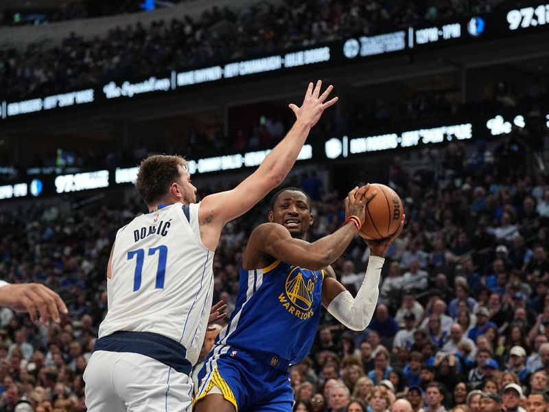 DALLAS, TX - MARCH 13: Jonathan Kuminga #00 of the Golden State Warriors handles the ball during the game against the Dallas Mavericks on March 13, 2024 at the American Airlines Center in Dallas, Texas. NOTE TO USER: User expressly acknowledges and agrees that, by downloading and or using this photograph, User is consenting to the terms and conditions of the Getty Images License Agreement. Mandatory Copyright Notice: Copyright 2024 NBAE (Photo by Glenn James/NBAE via Getty Images)