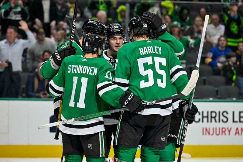 Apr 9, 2024; Dallas, Texas, USA; Dallas Stars center Wyatt Johnston (53) and center Logan Stankoven (11) and defenseman Thomas Harley (55) celebrates after Johnston scores a goal against the Buffalo Sabres during the second period at the American Airlines Center. Mandatory Credit: Jerome Miron-USA TODAY Sports