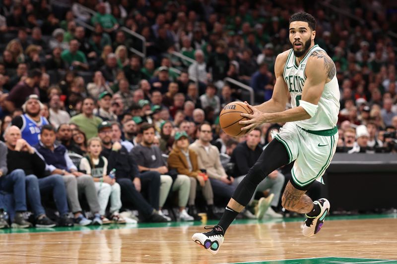 BOSTON, MASSACHUSETTS - JANUARY 10: Jayson Tatum #0 of the Boston Celtics drives to the basket against the Minnesota Timberwolves  at TD Garden on January 10, 2024 in Boston, Massachusetts. The Celtics defeat the Timberwolves 127-120 in overtime. NOTE TO USER: User expressly acknowledges and agrees that, by downloading and or using this photograph, user is consenting to the terms and conditions of the Getty Images License Agreement.  (Photo by Maddie Meyer/Getty Images)