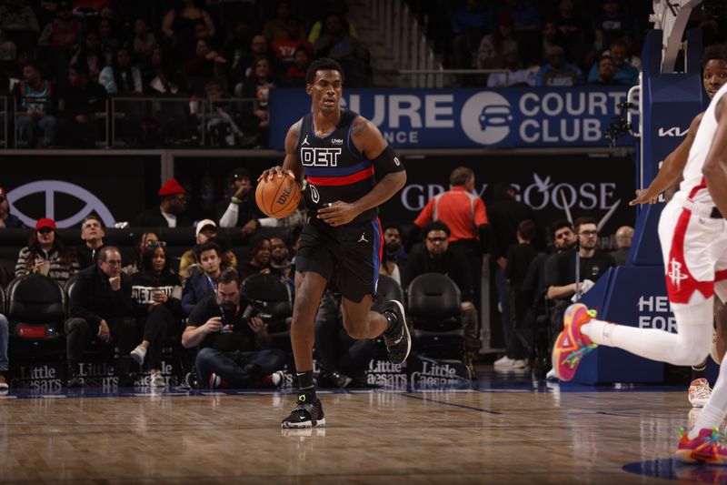 DETROIT, MI - JANUARY 12: Jalen Duren #0 of the Detroit Pistons handles the ball during the game against the Houston Rockets on January 12, 2024 at Little Caesars Arena in Detroit, Michigan. NOTE TO USER: User expressly acknowledges and agrees that, by downloading and/or using this photograph, User is consenting to the terms and conditions of the Getty Images License Agreement. Mandatory Copyright Notice: Copyright 2024 NBAE (Photo by Brian Sevald/NBAE via Getty Images)