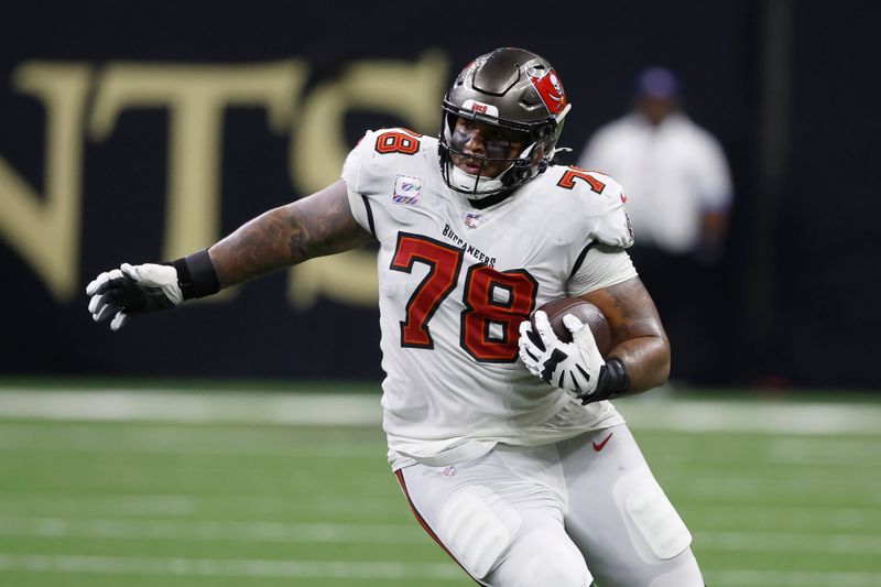 Tampa Bay Buccaneers offensive tackle Tristan Wirfs (78) runs against the New Orleans Saints during the first half of an NFL football game in New Orleans, Sunday, Oct. 13, 2024. (AP Photo/Butch Dill)