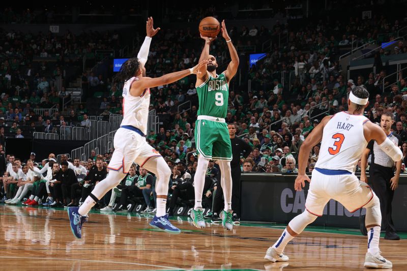 BOSTON, MA - OCTOBER 22: Derrick White #9 of the Boston Celtics shoots a three point basket during the game against the New York Knicks on October 22, 2024 at TD Garden in Boston, Massachusetts. NOTE TO USER: User expressly acknowledges and agrees that, by downloading and or using this Photograph, user is consenting to the terms and conditions of the Getty Images License Agreement. Mandatory Copyright Notice: Copyright 2024 NBAE (Photo by Nathaniel S. Butler/NBAE via Getty Images)