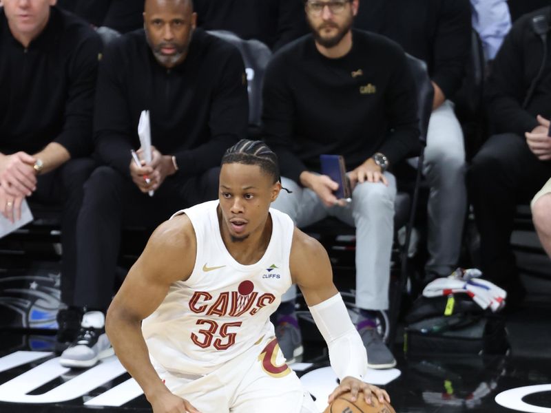 ORLANDO, FL - APRIL 27: Isaac Okoro #35 of the Cleveland Cavaliers handles the ball during the game against the Orlando Magic during Round 1 Game 4 of the 2024 NBA Playoffs on April 27, 2024 at the Kia Center in Orlando, Florida. NOTE TO USER: User expressly acknowledges and agrees that, by downloading and or using this photograph, User is consenting to the terms and conditions of the Getty Images License Agreement. Mandatory Copyright Notice: Copyright 2024 NBAE (Photo by David Sherman/NBAE via Getty Images)