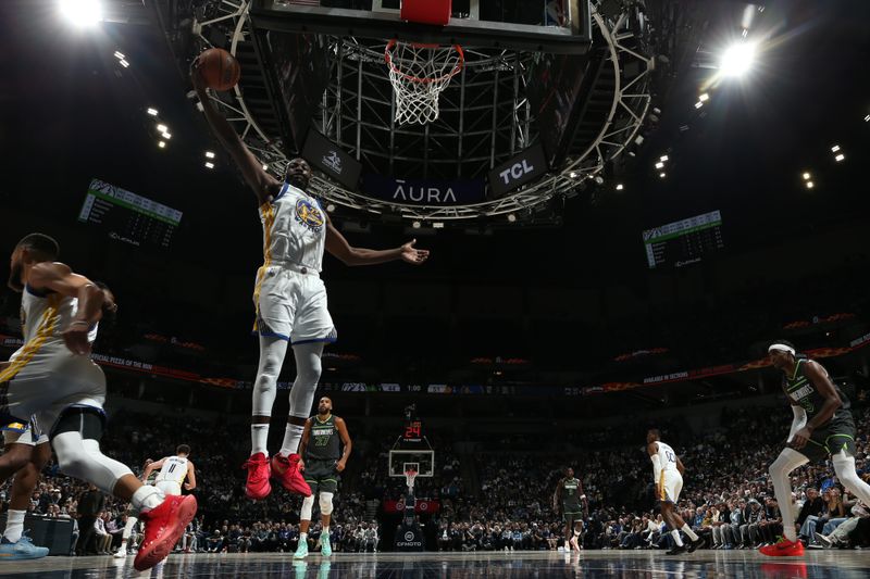 MINNEAPOLIS, MN -  MARCH 24: Draymond Green #23 of the Golden State Warriors goes up for the rebound during the game against the Minnesota Timberwolves on March 24, 2024 at Target Center in Minneapolis, Minnesota. NOTE TO USER: User expressly acknowledges and agrees that, by downloading and or using this Photograph, user is consenting to the terms and conditions of the Getty Images License Agreement. Mandatory Copyright Notice: Copyright 2024 NBAE (Photo by David Sherman/NBAE via Getty Images)