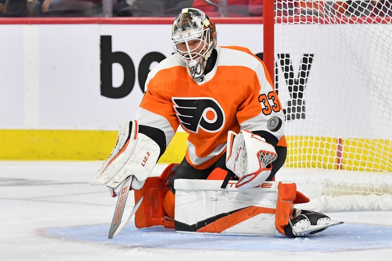 Sep 28, 2022; Philadelphia, Pennsylvania, USA; Philadelphia Flyers goaltender Samuel Ersson (33) makes a save against the Washington Capitals during the third period at Wells Fargo Center. Mandatory Credit: Eric Hartline-USA TODAY Sports