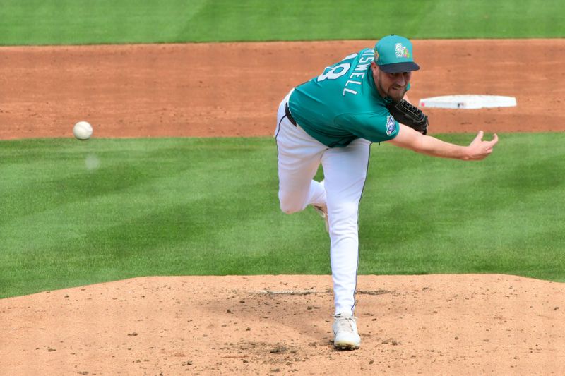 Feb 20, 2026; Peoria, Arizona, USA; Seattle Mariners pitcher Cooper Criswell (18) throws in the third inning against the San Diego Padres during a Spring Training game at Peoria Sports Complex. Mandatory Credit: Matt Kartozian-Imagn Images