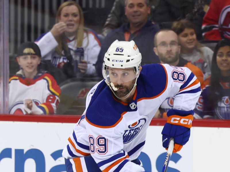 Dec 21, 2023; Newark, New Jersey, USA; Edmonton Oilers center Sam Gagner (89) skates with the puck against the New Jersey Devils during the first period at Prudential Center. Mandatory Credit: Ed Mulholland-USA TODAY Sports