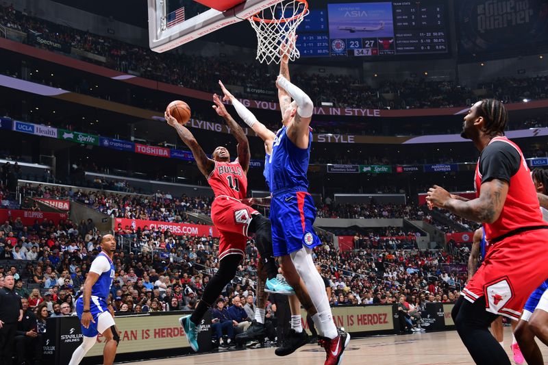 LOS ANGELES, CA - MARCH 9: DeMar DeRozan #11 of the Chicago Bulls shoots the ball during the game against the LA Clippers on March 9, 2024 at Crypto.Com Arena in Los Angeles, California. NOTE TO USER: User expressly acknowledges and agrees that, by downloading and/or using this Photograph, user is consenting to the terms and conditions of the Getty Images License Agreement. Mandatory Copyright Notice: Copyright 2024 NBAE (Photo by Adam Pantozzi/NBAE via Getty Images)