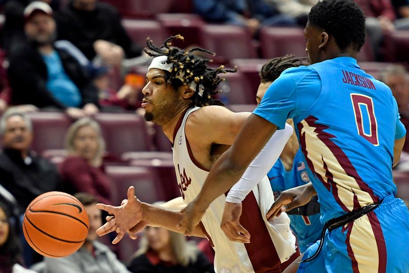 Feb 18, 2023; Tallahassee, Florida, USA; Boston College Eagles forward TJ Bickerstaff (1) has the ball knocked away from behind during the first half against the Florida State Seminoles at Donald L. Tucker Center. Mandatory Credit: Melina Myers-USA TODAY Sports