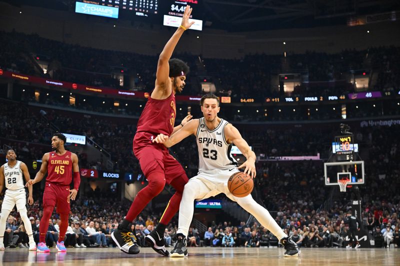 CLEVELAND, OHIO - FEBRUARY 13: Zach Collins #23 of the San Antonio Spurs drives around Jarrett Allen #31 of the Cleveland Cavaliers during the second quarter at Rocket Mortgage Fieldhouse on February 13, 2023 in Cleveland, Ohio. NOTE TO USER: User expressly acknowledges and agrees that, by downloading and or using this photograph, User is consenting to the terms and conditions of the Getty Images License Agreement. (Photo by Jason Miller/Getty Images)