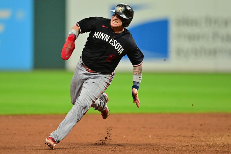 Sep 5, 2023; Cleveland, Ohio, USA; Minnesota Twins catcher Christian Vazquez (8) advances to third on a hit by center fielder Willi Castro (not pictured) during the eighth inning against the Cleveland Guardians at Progressive Field. Mandatory Credit: Ken Blaze-USA TODAY Sports