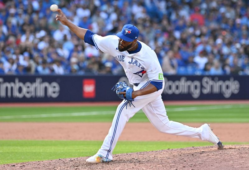 Aug 27, 2023; Toronto, Ontario, CAN;  Toronto Blue Jays relief pitcher Jay Jackson (35) delivers a pitch against the Cleveland Guardians in the 11th inning at Rogers Centre. Mandatory Credit: Dan Hamilton-USA TODAY Sports