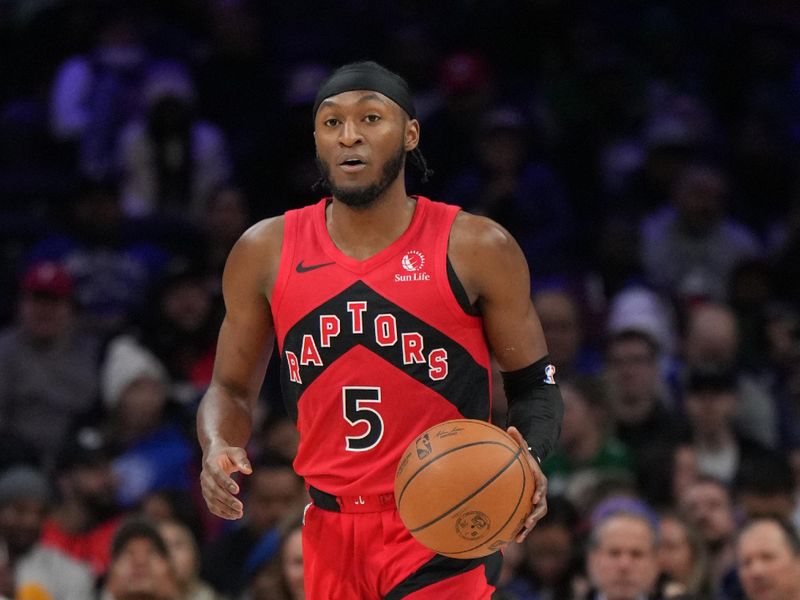 PHILADELPHIA, PA - FEBRUARY 11:  Immanuel Quickley #5 of the Toronto Raptors dribbles the ball during the game against the Philadelphia 76ers  on February 11, 2025 at the Wells Fargo Center in Philadelphia, Pennsylvania NOTE TO USER: User expressly acknowledges and agrees that, by downloading and/or using this Photograph, user is consenting to the terms and conditions of the Getty Images License Agreement. Mandatory Copyright Notice: Copyright 2025 NBAE (Photo by Jesse D. Garrabrant/NBAE via Getty Images)