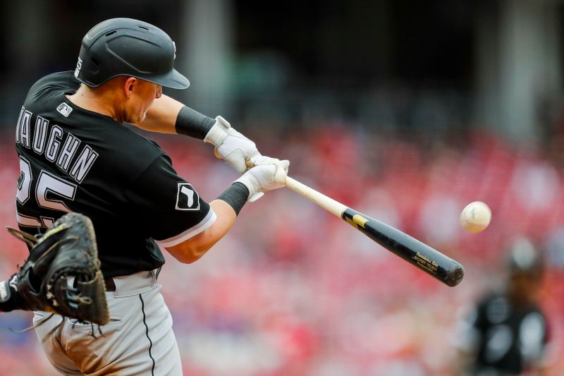 May 7, 2023; Cincinnati, Ohio, USA; Chicago White Sox first baseman Andrew Vaughn (25) hits a sacrifice fly against the Cincinnati Reds in the fifth inning at Great American Ball Park. Mandatory Credit: Katie Stratman-USA TODAY Sports