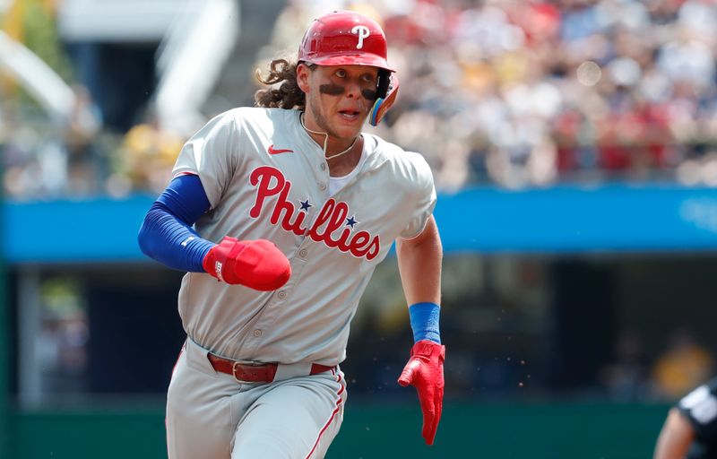 Jul 21, 2024; Pittsburgh, Pennsylvania, USA;  Philadelphia Phillies third baseman Alec Bohm (28) runs from first base to third base against the Pittsburgh Pirates during the second inning at PNC Park. Mandatory Credit: Charles LeClaire-USA TODAY Sports