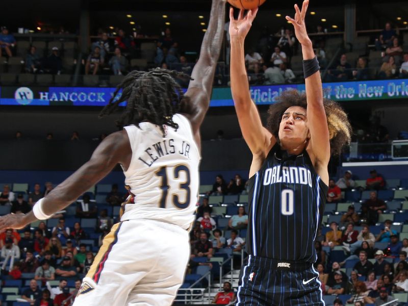 NEW ORLEANS, LA - OCTOBER 10: Anthony Black #0 of the Orlando Magic shoots a three point basket against the New Orleans Pelicans on October 10, 2023 at the Smoothie King Center in New Orleans, Louisiana. NOTE TO USER: User expressly acknowledges and agrees that, by downloading and or using this Photograph, user is consenting to the terms and conditions of the Getty Images License Agreement. Mandatory Copyright Notice: Copyright 2023 NBAE (Photo by Layne Murdoch Jr./NBAE via Getty Images)
