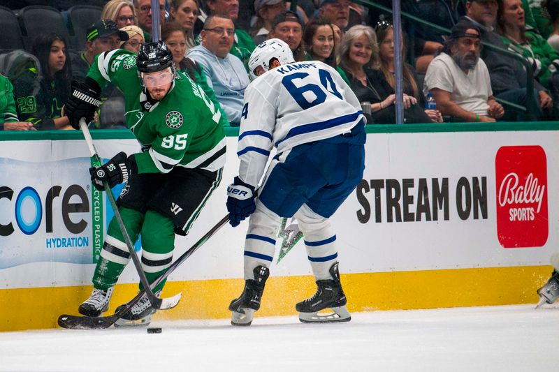 Oct 26, 2023; Dallas, Texas, USA; Dallas Stars center Matt Duchene (95) looks to move the puck past Toronto Maple Leafs center David Kampf (64) during the third period at the American Airlines Center. Mandatory Credit: Jerome Miron-USA TODAY Sports