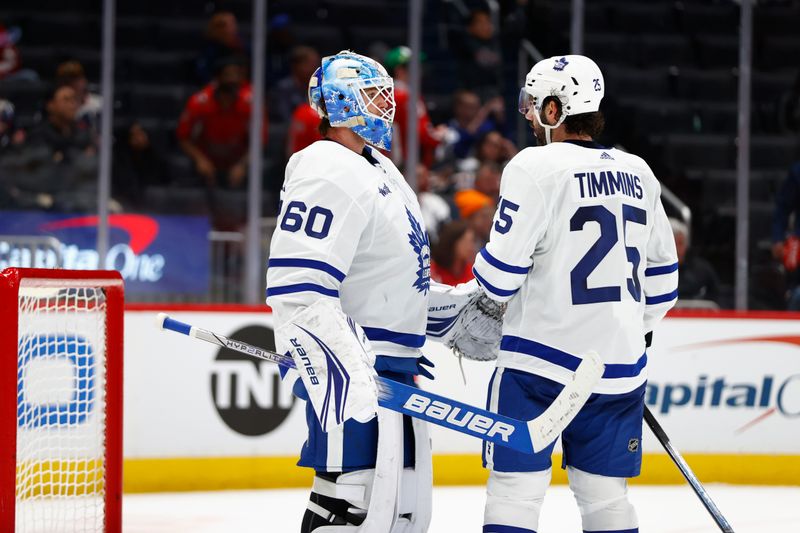 Mar 20, 2024; Washington, District of Columbia, USA; Toronto Maple Leafs goaltender Joseph Woll (60) celebrates with Maple Leafs defenseman Conor Timmins (25) after defeating the Washington Capitals at Capital One Arena. Mandatory Credit: Amber Searls-USA TODAY Sports