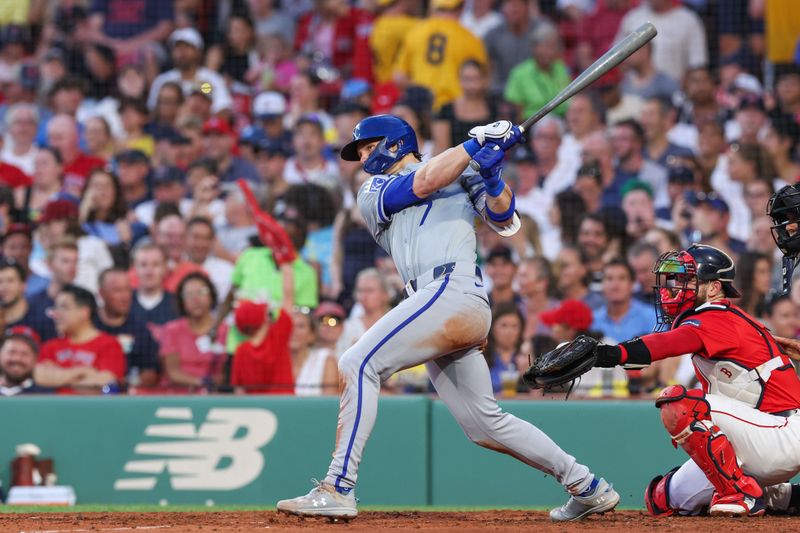 Jul 12, 2024; Boston, Massachusetts, USA; Kansas City Royals shortstop Bobby Witt Jr (7) hits a solo home run during the fourth inning against the Boston Red Sox at Fenway Park. Mandatory Credit: Paul Rutherford-USA TODAY Sports