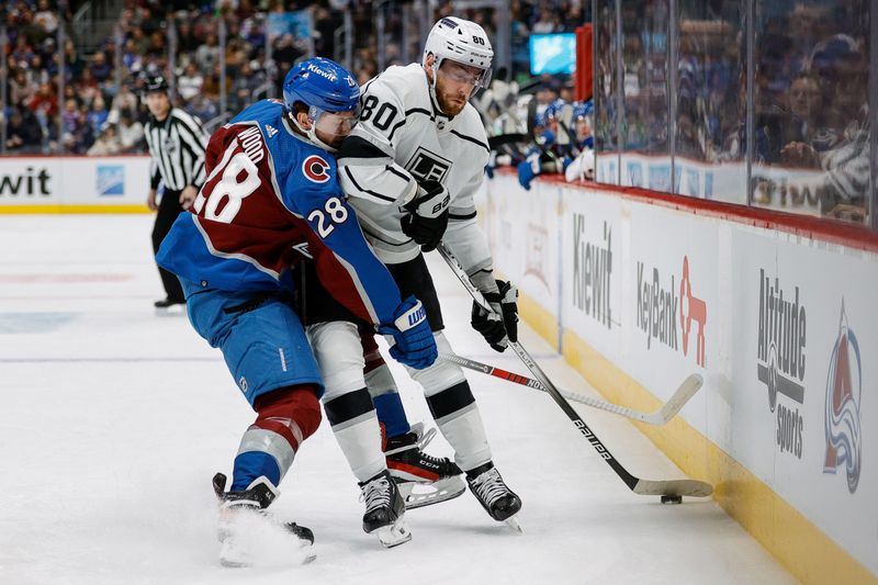 Jan 26, 2024; Denver, Colorado, USA; Colorado Avalanche left wing Miles Wood (28) and Los Angeles Kings center Pierre-Luc Dubois (80) battle for the puck in the first period at Ball Arena. Mandatory Credit: Isaiah J. Downing-USA TODAY Sports