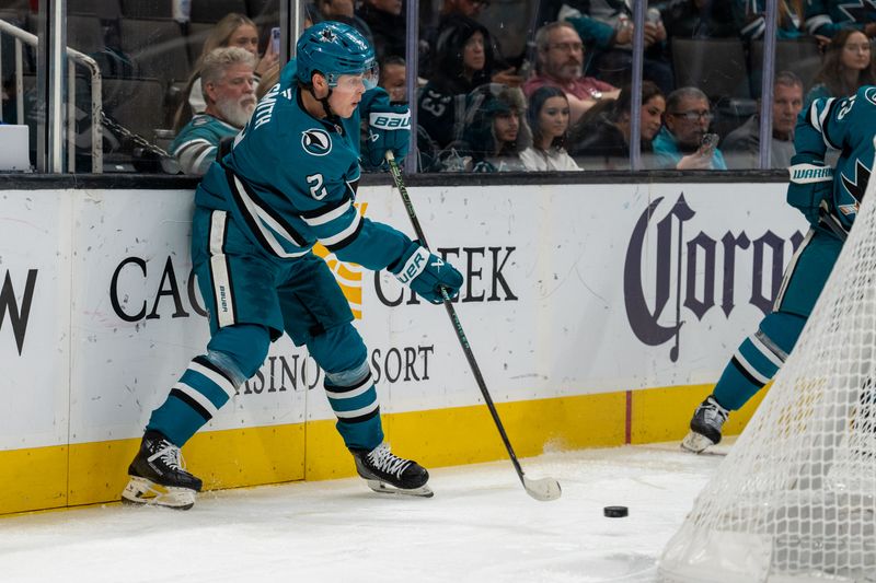 Nov 5, 2024; San Jose, California, USA;  San Jose Sharks center Will Smith (2) passes the puck from behind the net against the Columbus Blue Jackets during the second period at SAP Center at San Jose. Mandatory Credit: Neville E. Guard-Imagn Images