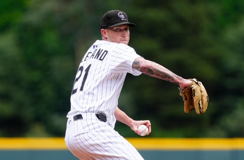 Aug 6, 2025; Denver, Colorado, USA; Colorado Rockies starring pitcher Kyle Freeland (21) delivers a pitch in the first inning against the Toronto Blue Jays at Coors Field. Mandatory Credit: Ron Chenoy-Imagn Images
