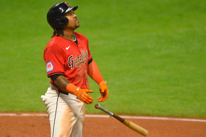 Sep 25, 2024; Cleveland, Ohio, USA; Cleveland Guardians third baseman Jose Ramirez (11) watches his three-run home run in the eighth inning against the Cincinnati Reds at Progressive Field. Mandatory Credit: David Richard-Imagn Images