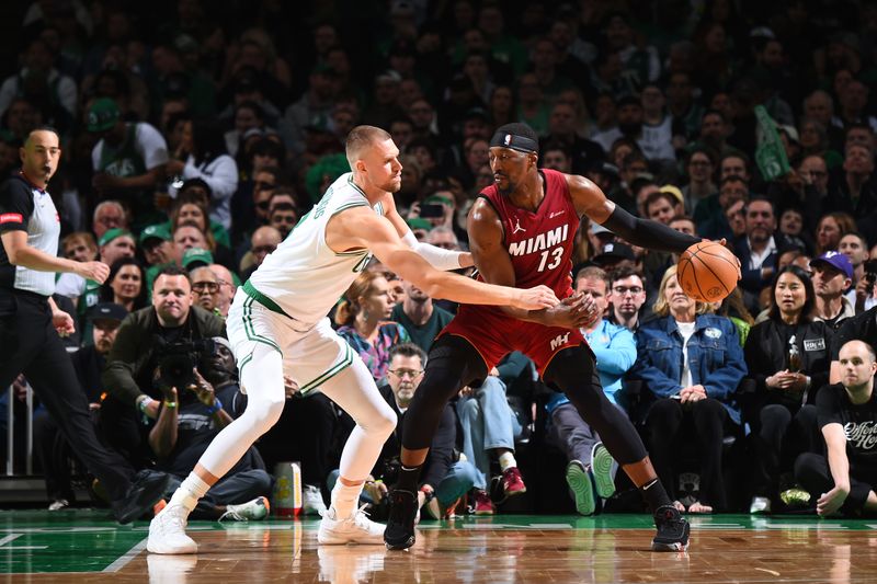 BOSTON, MA - APRIL 21: Bam Adebayo #13 of the Miami Heat dribbles the ball during the game against the Boston Celtics during Round 1 Game 1 of the 2024 NBA Playoffs on April 21, 2024 at the TD Garden in Boston, Massachusetts. NOTE TO USER: User expressly acknowledges and agrees that, by downloading and or using this photograph, User is consenting to the terms and conditions of the Getty Images License Agreement. Mandatory Copyright Notice: Copyright 2024 NBAE  (Photo by Brian Babineau/NBAE via Getty Images)