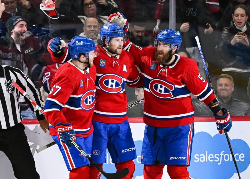 Mar 9, 2023; Montreal, Quebec, CAN; Montreal Canadiens right wing Josh Anderson (17) celebrates his goal against the New York Rangers with center Chris Tierney (67) and defenseman David Savard (58) during the second period at Bell Centre. Mandatory Credit: David Kirouac-USA TODAY Sports