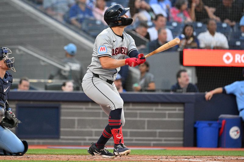 Jun 14, 2024; Toronto, Ontario, CAN;  Cleveland Indians right fielder Will Brennan (17) hits a solo home run against the Toronto Blue Jays in the fifth inning at Rogers Centre. Mandatory Credit: Dan Hamilton-USA TODAY Sports